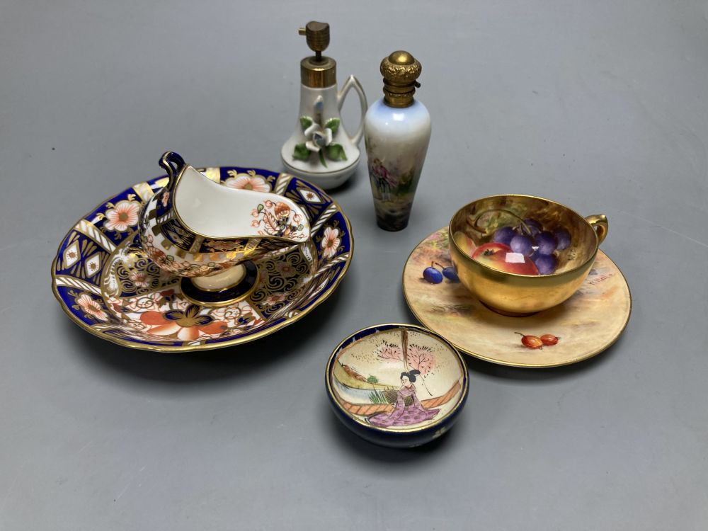 A Royal Worcester miniature cup and saucer painted with fruit, signed W. Hale, height 4cm, two scent bottles and sundries